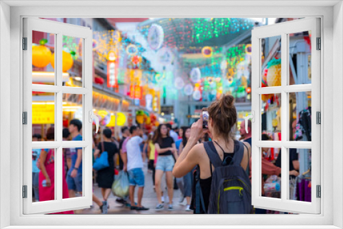 2019 March 1st, Singapore, Chinatown - People walking and shopping on the street market after sunset.