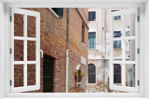 Fototapeta Naklejka Na Ścianę Okno 3D - VENICE, ITALY - December 21, 2017 : street view of old buildings in Venice, ITALY
