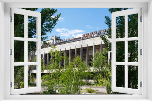 Fototapeta Naklejka Na Ścianę Okno 3D - PRIPYAT, UKRAINE - June, 2016: Palace of Culture in abandoned ghost town of Pripyat, Chernobyl NPP alienation zone. Inscription on building - Palace of Culture Energetic