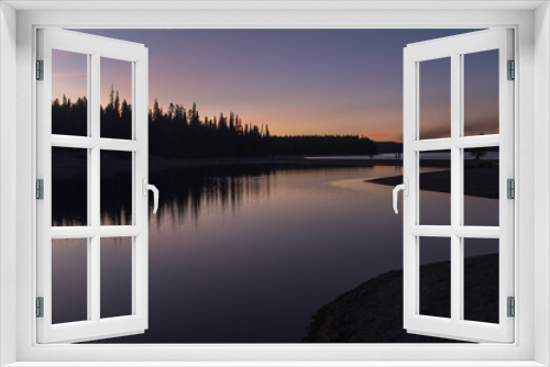 Fototapeta Naklejka Na Ścianę Okno 3D - A stunning sunset on a lake in Yellowstone National Park, reflections of colours in the lakes waters