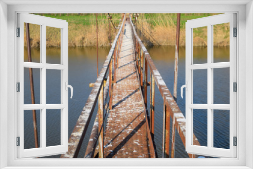 Fototapeta Naklejka Na Ścianę Okno 3D - Steel bridge and gas pipeline through irrigation canal.