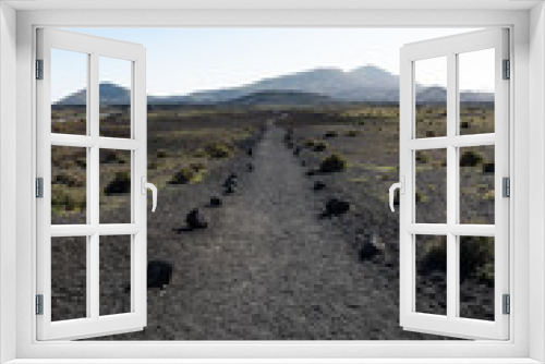 Fototapeta Naklejka Na Ścianę Okno 3D - Lava walking path through volcanic terrain near Timanfaya national park on Lanzarote island, Canary Islands, Spain