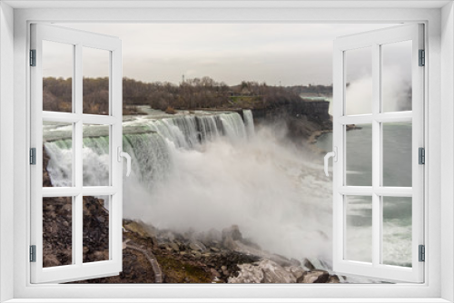 Fototapeta Naklejka Na Ścianę Okno 3D - USA, Niagara Falls, April 2019: View of Niagara Falls with the side of United Stets of America