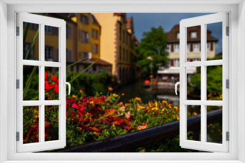 Fototapeta Naklejka Na Ścianę Okno 3D - View of the most characteristic and particular city of Southern France with its houses that recall distant times. Floral traditional town Colmar with charming old streets in Alsace region.