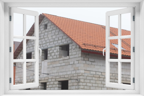 Fototapeta Naklejka Na Ścianę Okno 3D - Roof in a brick house under construction