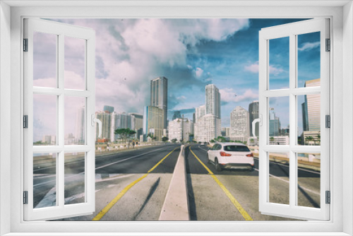 Fototapeta Naklejka Na Ścianę Okno 3D - Entering Miami on the road with a beautiful city skyline, Florida, USA