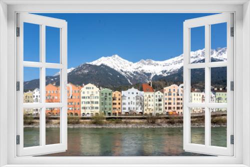 Fototapeta Naklejka Na Ścianę Okno 3D - Innsbruck, Tyrol, Austria. Colored houses on the Inn River in Innsbruck. Colored houses in Innsbruck.