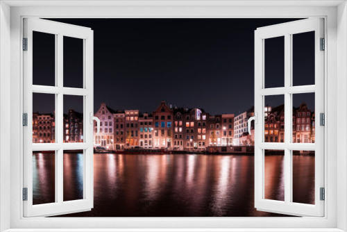 Fototapeta Naklejka Na Ścianę Okno 3D - Amsterdam City night river water reflection long expo landscape tourist vacation attraction houses, Holland, Netherlands
