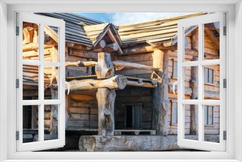 Fototapeta Naklejka Na Ścianę Okno 3D - Ecological wooden house. Wooden house with meadow in front of it. Beautiful modern wooden house.