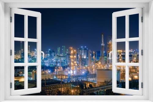 Fototapeta Naklejka Na Ścianę Okno 3D - Oil and Gas refinery industry plant with glitter lighting, Factory of petroleum industrial at night time, Petrochemical plant with gas distillation tower and storage tank