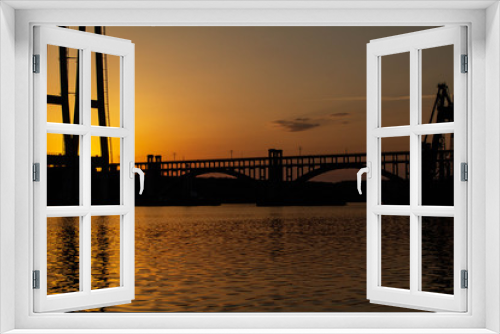 Fototapeta Naklejka Na Ścianę Okno 3D - Sunset over the river Dnieper. Bridge.
