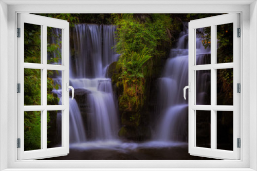 Fototapeta Naklejka Na Ścianę Okno 3D - The waterfall at Penllergare Valley Woods on the Afon Llan river, easily accessible just off junction 47 of the M4 motorway in Swansea, UK.