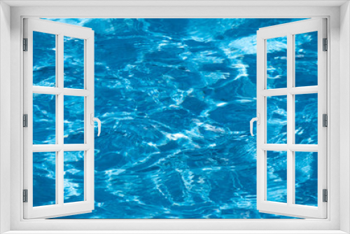 Fototapeta Naklejka Na Ścianę Okno 3D - Blue and bright ripple water surface in swimming pool with sun reflection.