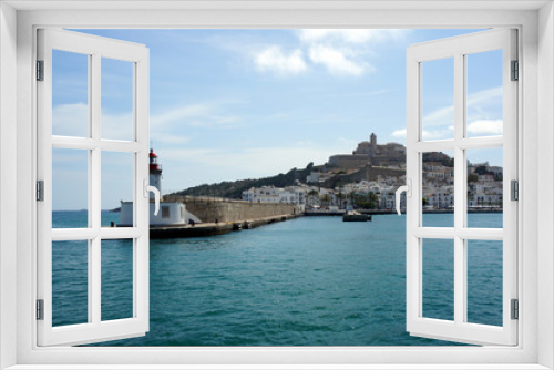 Fototapeta Naklejka Na Ścianę Okno 3D - Lighthouse on the pier of Ibiza harbor.