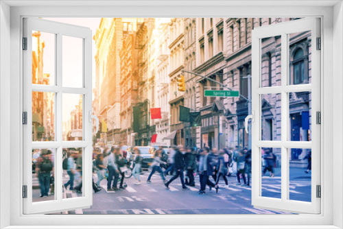 Fototapeta Naklejka Na Ścianę Okno 3D - Diverse groups of people walk across the crowded intersection of Broadway and Spring Street in the SoHo neighborhood of Manhattan in New York City