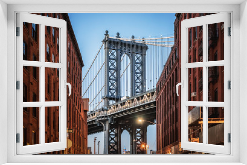 Fototapeta Naklejka Na Ścianę Okno 3D - Dumbo - The famous Manhattan bridge between two red brick buildings in Brooklyn - New York City, NY
