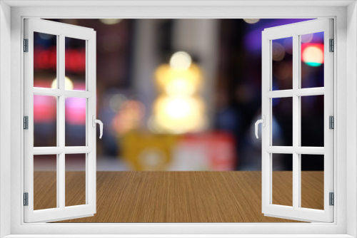 Empty dark wooden table in front of abstract blurred bokeh background of restaurant . can be used for display or montage your products.Mock up for space.