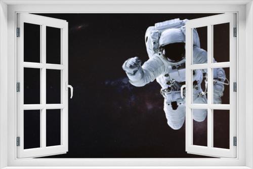 Fototapeta Naklejka Na Ścianę Okno 3D - Astronaut in outer space. Science fiction wallpaper. Elements of this image were furnished by NASA.