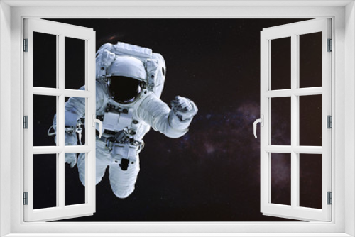 Fototapeta Naklejka Na Ścianę Okno 3D - Astronaut in outer space. Science fiction wallpaper. Elements of this image were furnished by NASA.