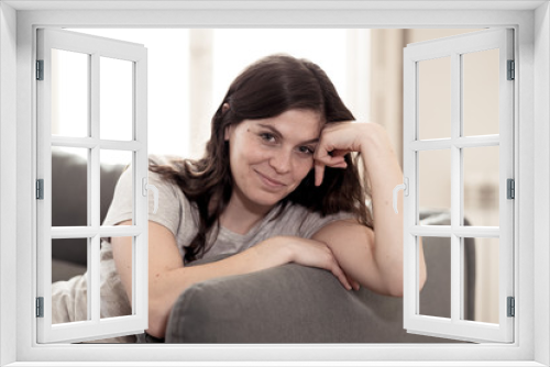 Beautiful lifestyle portrait of young woman happy and relaxed at home