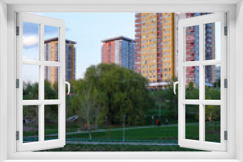 Fototapeta Naklejka Na Ścianę Okno 3D - image of high-rise residential buildings on the river bank