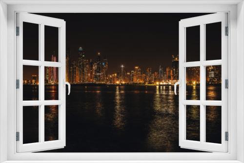Fototapeta Naklejka Na Ścianę Okno 3D - Night city lights. District Dubai Marina from observation platform of palm Jumeirah. Dubai at may 2019