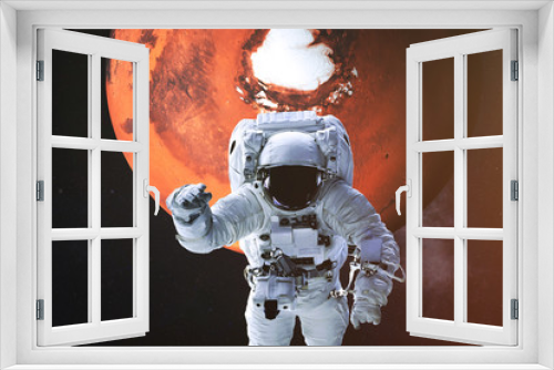 Fototapeta Naklejka Na Ścianę Okno 3D - Astronaut in a front of Mars planet of solar system with lens flare. Science fiction. Elements of the image were furnished by NASA
