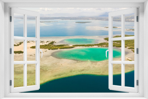 Fototapeta Naklejka Na Ścianę Okno 3D - Tropical island with mangroves and turquoise lagoons on a coral reef, top view. Fraser Island, seascape Honda Bay, Philippines. Atolls with lagoons and white sand.