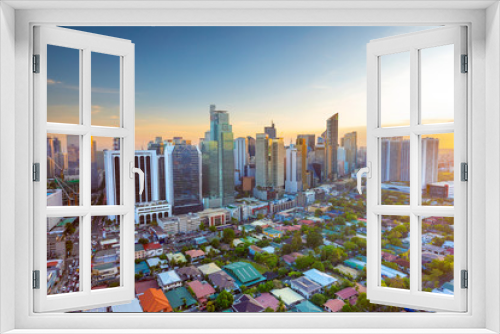 Fototapeta Naklejka Na Ścianę Okno 3D - Elevated, sunset view of Makati, the business district of Metro Manila,  Philippines