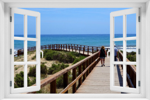 Fototapeta Naklejka Na Ścianę Okno 3D - Wooden walkways leading directly to a beautiful beach of fine sand