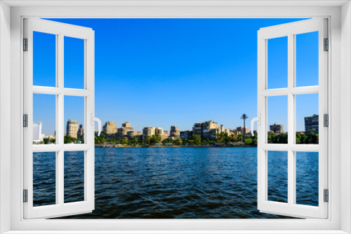 Residential and office buildings of the Cairo city. View from Nile river