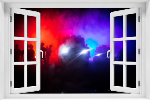 Fototapeta Naklejka Na Ścianę Okno 3D - Police cars at night. Police car chasing a car at night with fog background. 911 Emergency response pSelective focus