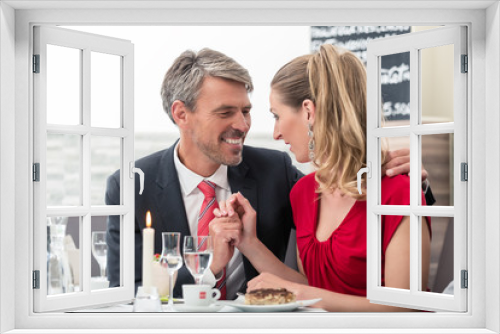 Husband and wife on date in restaurant