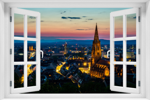 Fototapeta Naklejka Na Ścianę Okno 3D - Germany, Enchanted romantic sunset light over city freiburg im breisgau in baden