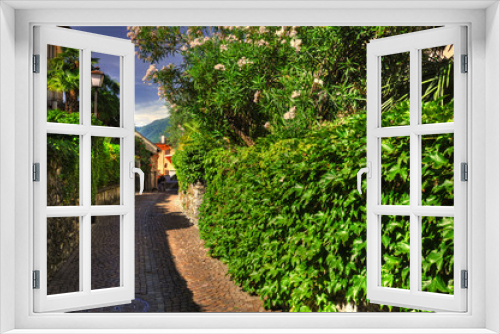 Fototapeta Naklejka Na Ścianę Okno 3D - Narrow Street with Green Plants in Ascona, Switzerland.