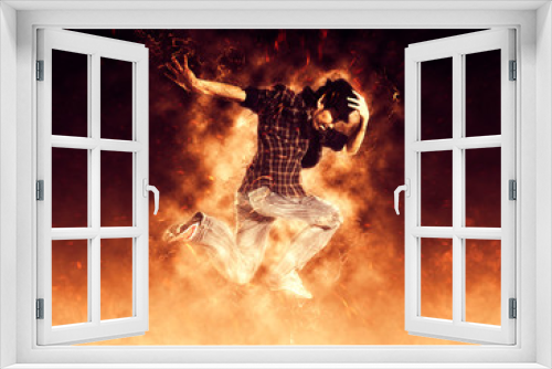 Fototapeta Naklejka Na Ścianę Okno 3D - Man break dancing on fire background