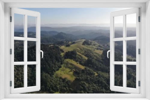 Fototapeta Naklejka Na Ścianę Okno 3D - Aerial view of the verdant hills with trees in Napa Valley during summer season. Napa County, in California’s Wine Country, Part of the North Bay region of the San Francisco Bay Area. Vineyard area.