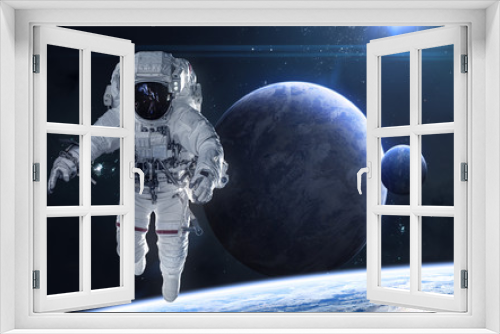 Fototapeta Naklejka Na Ścianę Okno 3D - Astronaut on background of planets in deep space. Beautiful cosmic landscape in blue light. Science fiction. Elements of this image furnished by NASA