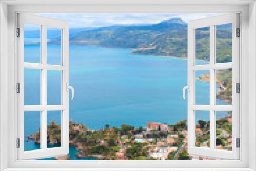 Fototapeta Naklejka Na Ścianę Okno 3D - Amazing view of a bay surrounding the coastal Sicilian village Cefalu from above with the hilly landscape in the background. The beautiful city is a popular Italian holiday destination
