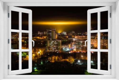 Fototapeta Naklejka Na Ścianę Okno 3D - Night cityscape with yellow glow the glow from the industrial greenhouses in the sky