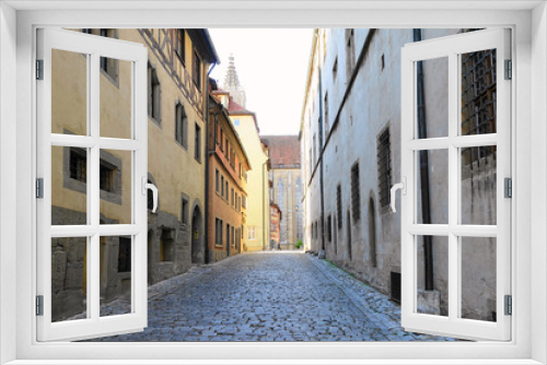 Fototapeta Naklejka Na Ścianę Okno 3D - Deserted narrow cobblestone street in medieval village in Germany