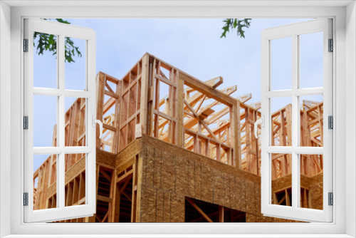 Fototapeta Naklejka Na Ścianę Okno 3D - Building of New Home Construction exterior wood beam construction