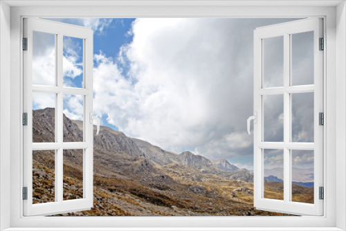 Fototapeta Naklejka Na Ścianę Okno 3D - Rocky mountain scenery with clouds in sunny day.