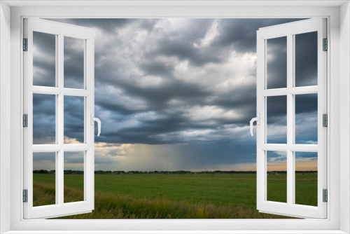 Fototapeta Naklejka Na Ścianę Okno 3D - Beautiful textured clouds as a thunderstorm moves away over the countryside of Holland