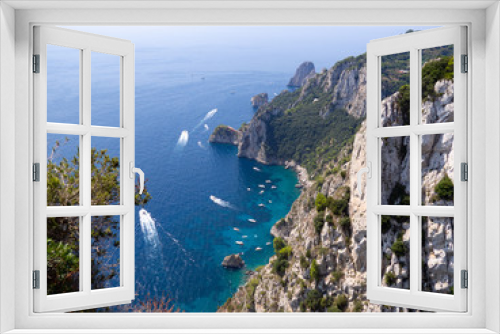 Fototapeta Naklejka Na Ścianę Okno 3D - Beautiful view of dramatic cliffs and beautiful blue water in Capri Island in Italy