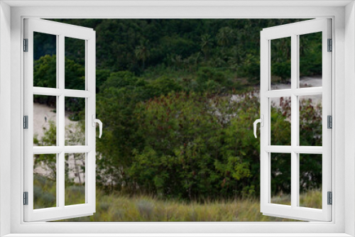 Fototapeta Naklejka Na Ścianę Okno 3D - The spectacular beauty of the white sand and blue sea on the Koka beach, Maumere, Flores, Indonesia, seen from the top of the meadow hill