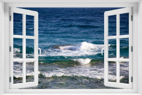 Fototapeta Naklejka Na Ścianę Okno 3D - Blue clear water. Beautiful blue sea wave photograph close up. Beach vacation at sea or ocean. Background to insert images and text. Tourism, travel. Big wave with a white hat