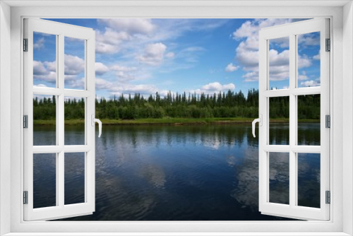Fototapeta Naklejka Na Ścianę Okno 3D - Reflection of blue shy with clouds in River, with forrest between river and sky
