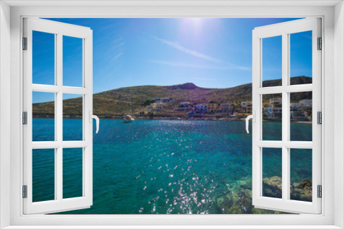 Fototapeta Naklejka Na Ścianę Okno 3D - bright blue turquoise sea sun's  reflection on the water and green hills at the background in Greece Island Kalymnos 