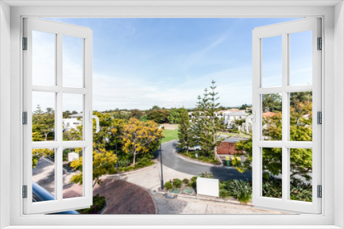 Fototapeta Naklejka Na Ścianę Okno 3D - View from the Balcony of Skyline Featuring Trees and Houses